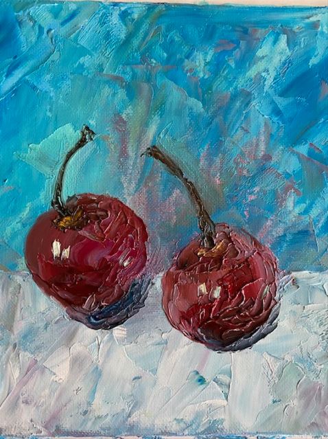 Painting of two dark red cherries with a background of blue and white