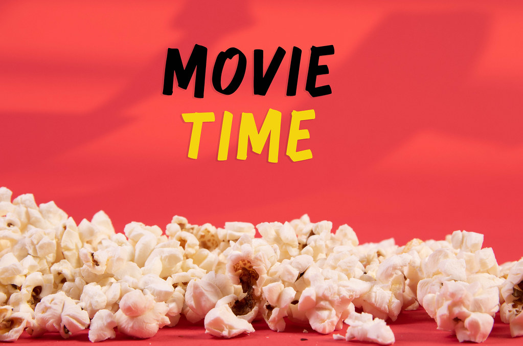red background with popcorn and text that says "movie time"