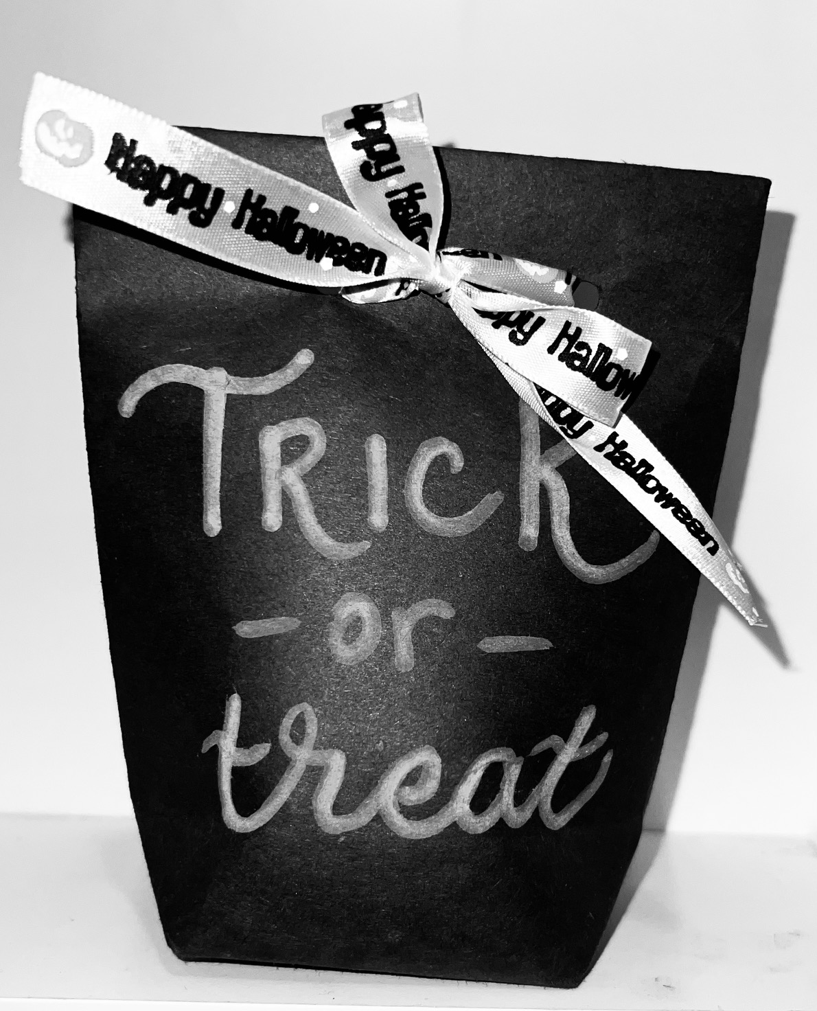 Black and white treat bag that says Trick or Treat