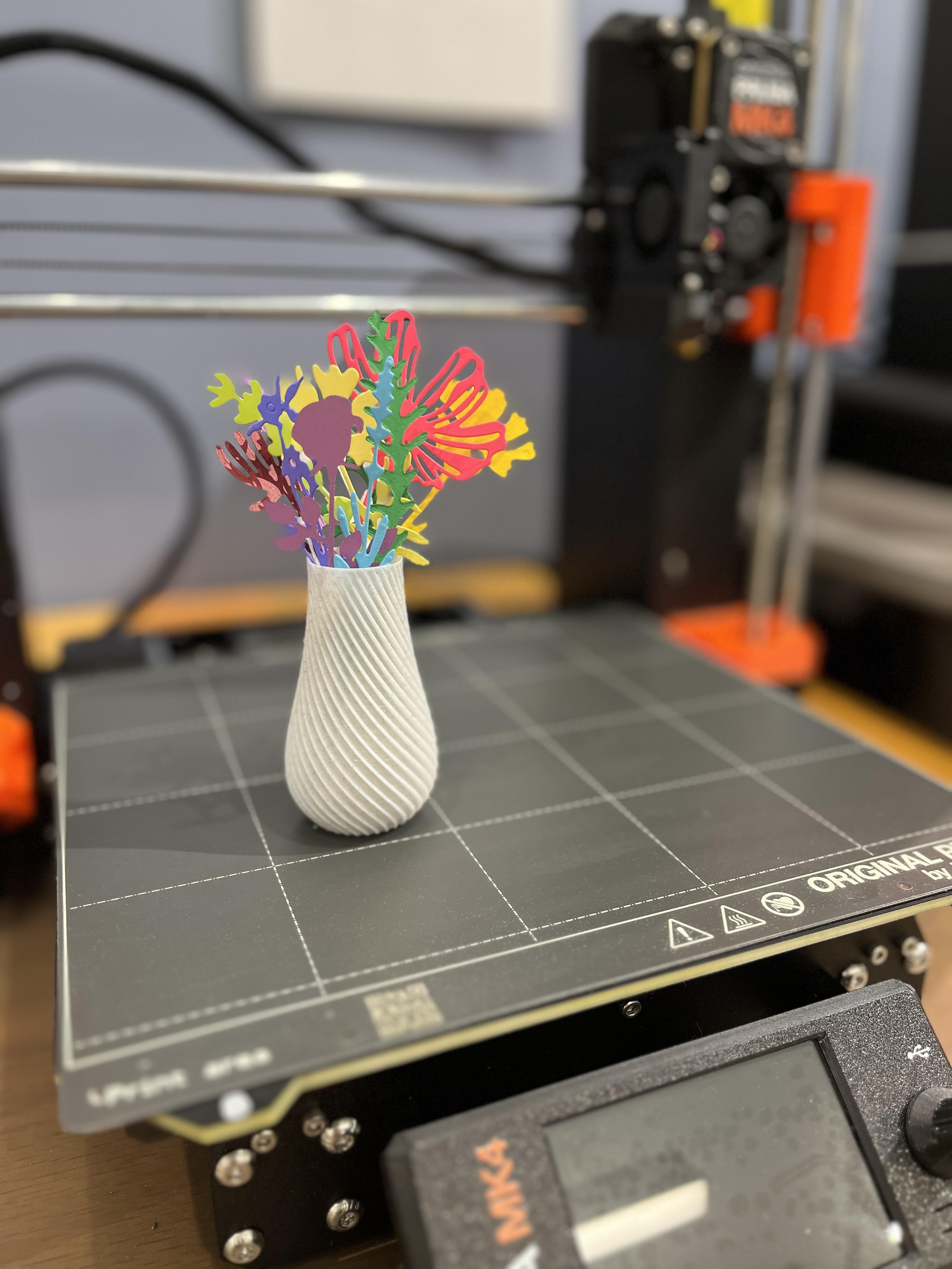 Small 3D printed vase with paper flowers
