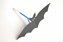 Paper bat with plastic straw mechanism to make it flap its wings