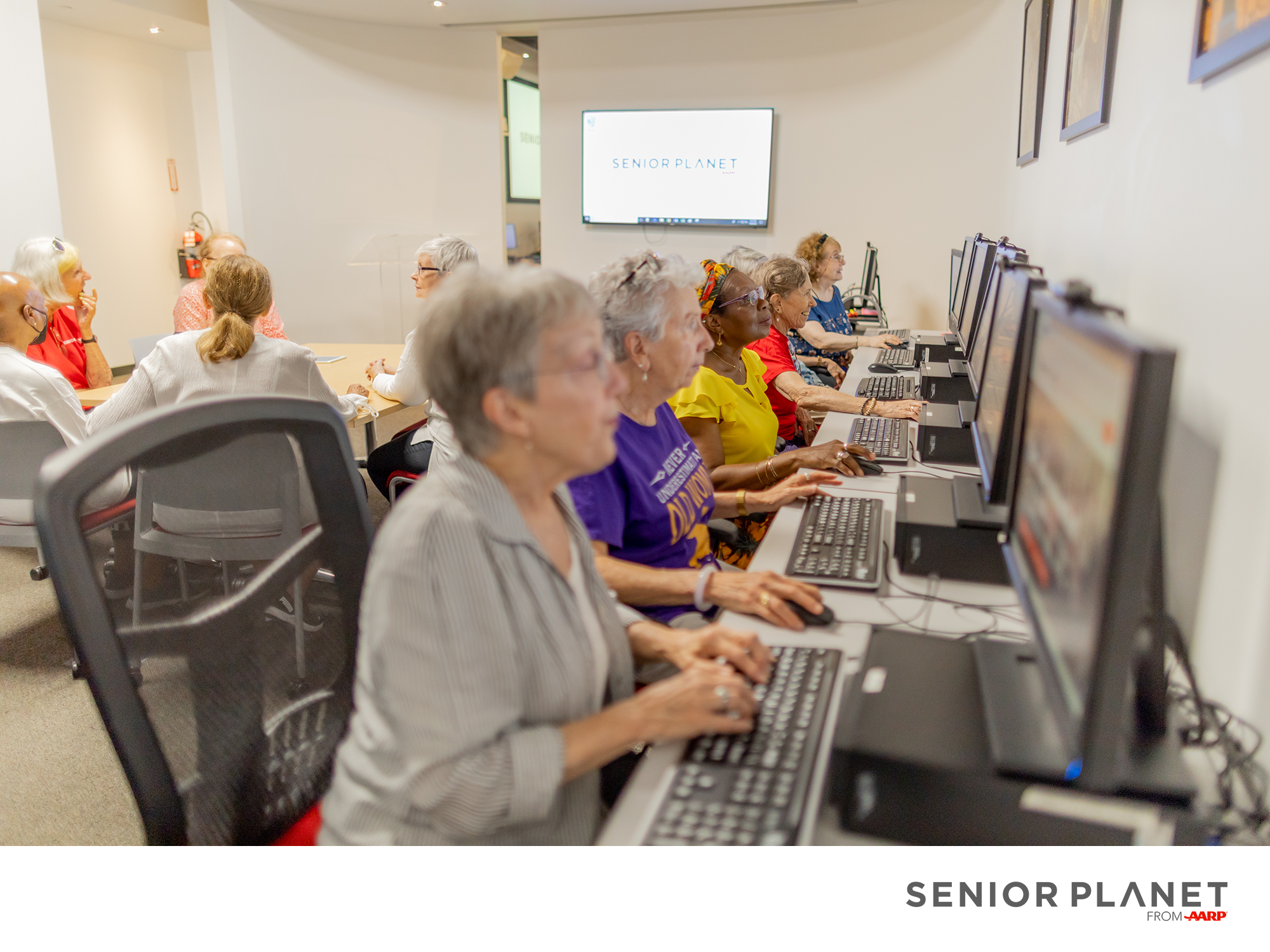 Older adults using computers in a computer lab