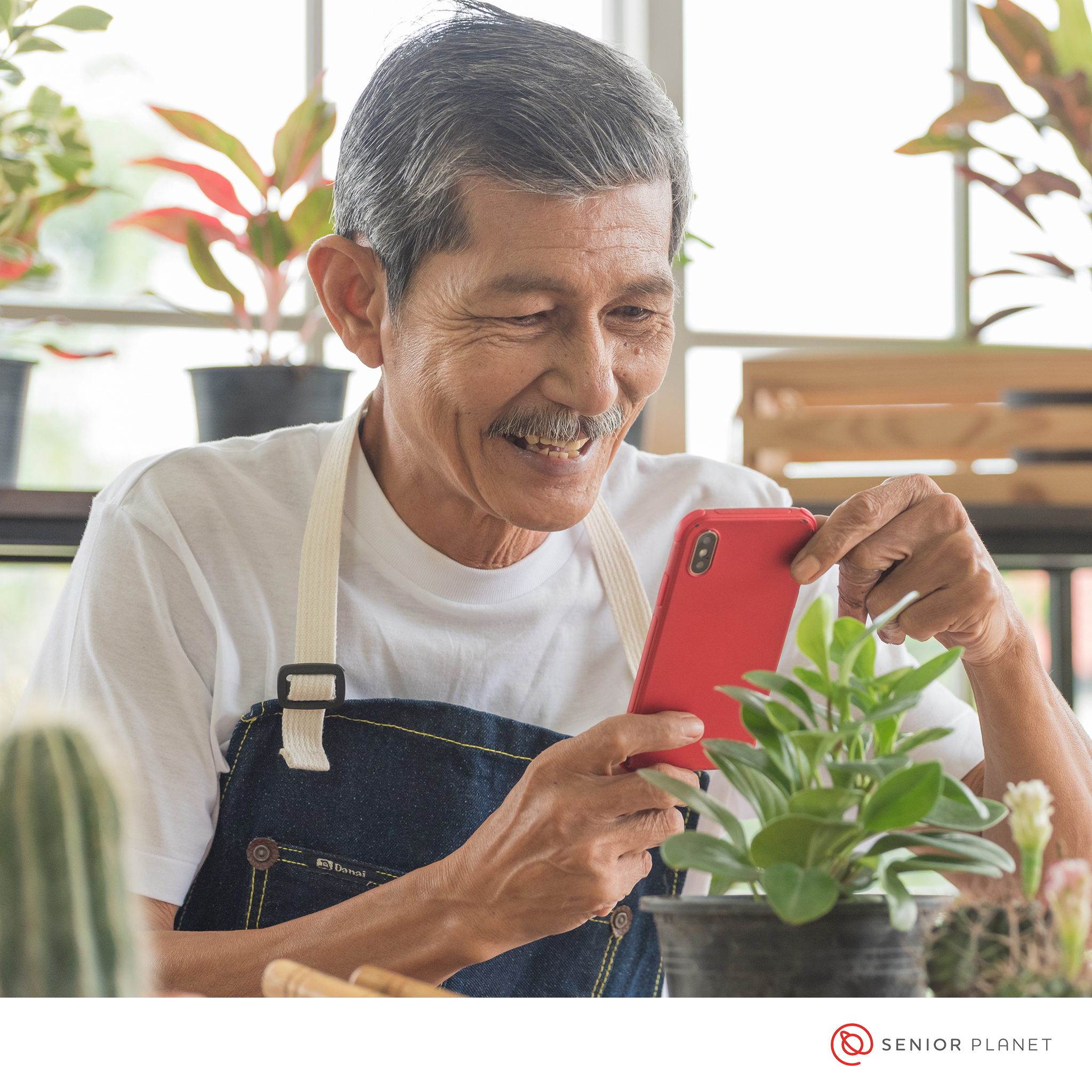 An older gentleman using a smartphone