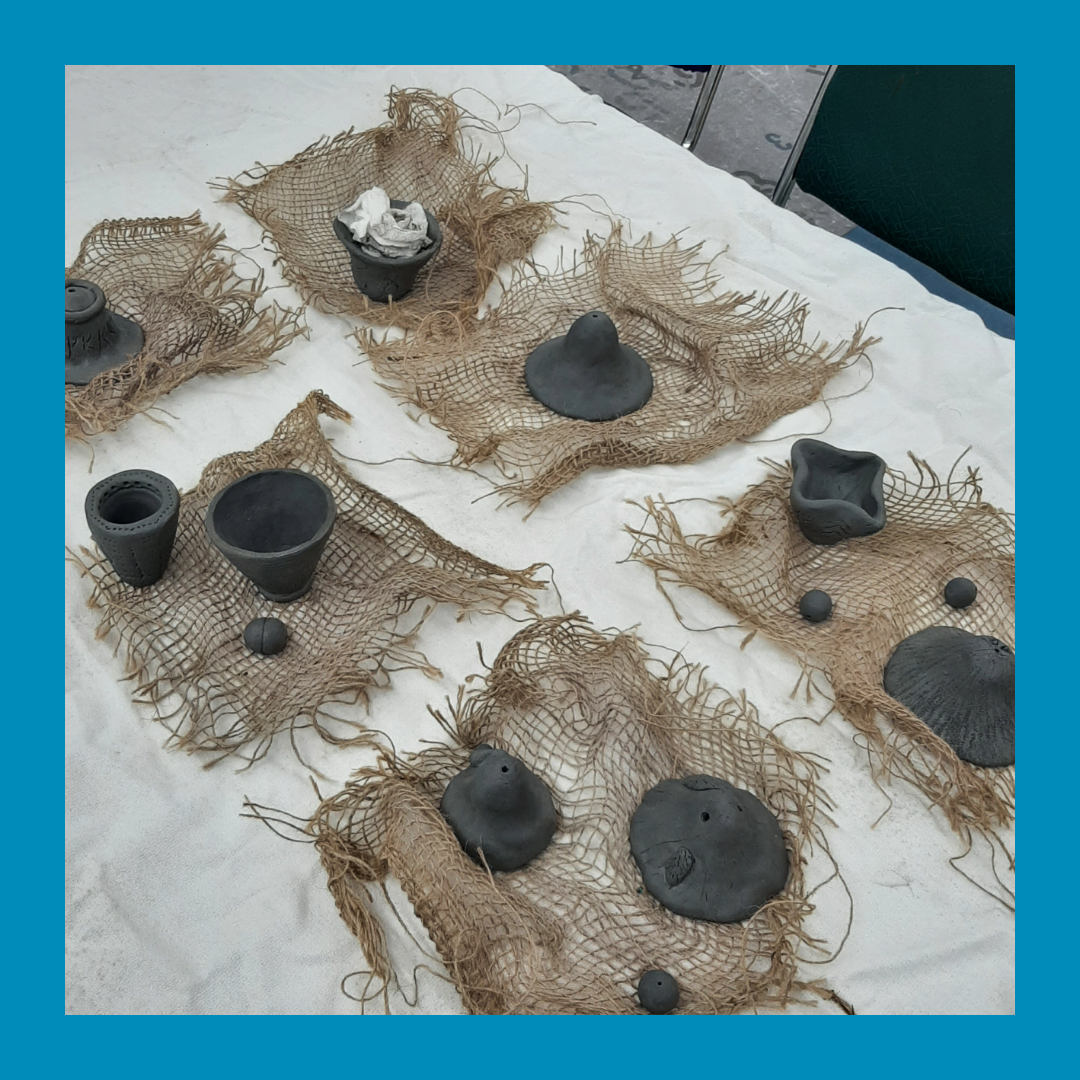 Some hand built ceramic "pots" in the drying phase, made at the Mammen Family Public Library, during a Makerspace program