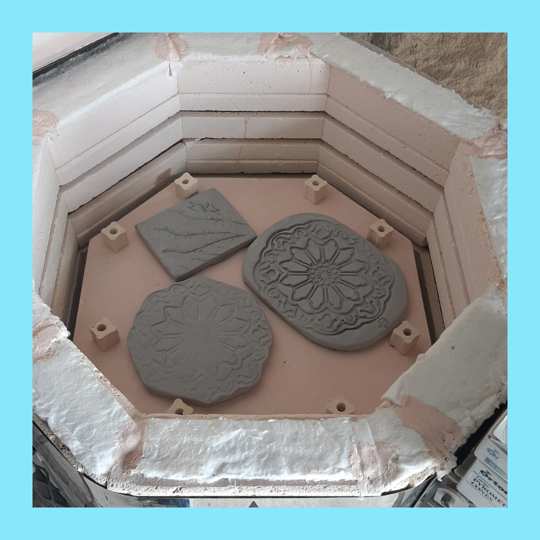 Greenware (trivets) made at the Mammen Family Public Library during a Makerspace program, about to be fired.