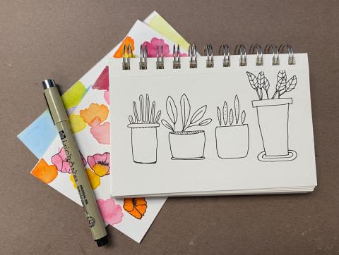 Cartoon drawing of plants and some watercolor sketches and micron pen