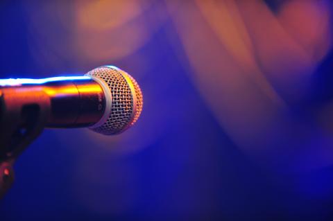 close up of a microphone in blueish light