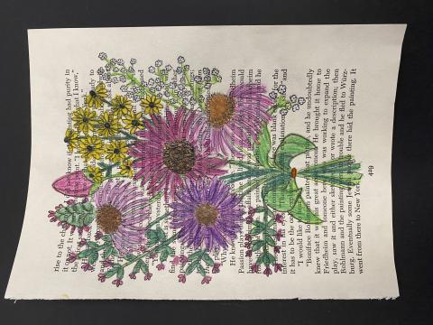 Flowers colored on an old book page