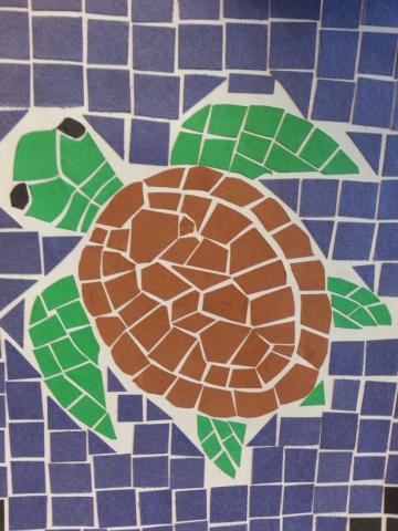 turtle mosaic made out of brown, green, and blue construction paper