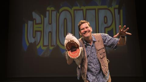lucas miller with a shark puppet
