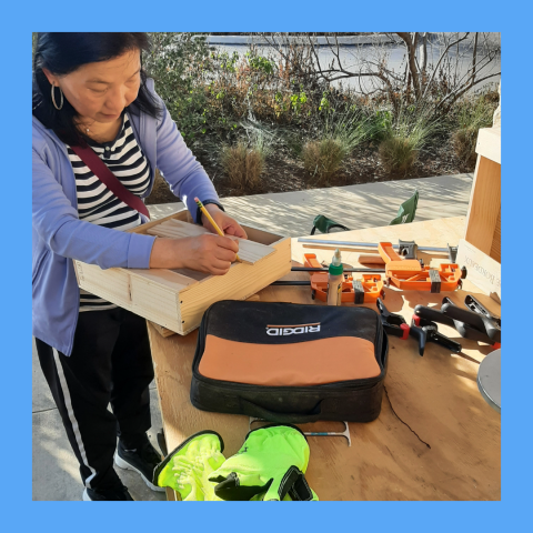 A Patron working on a Woodworking project a the Mammen Family Public Library, hosted by the Makerspace