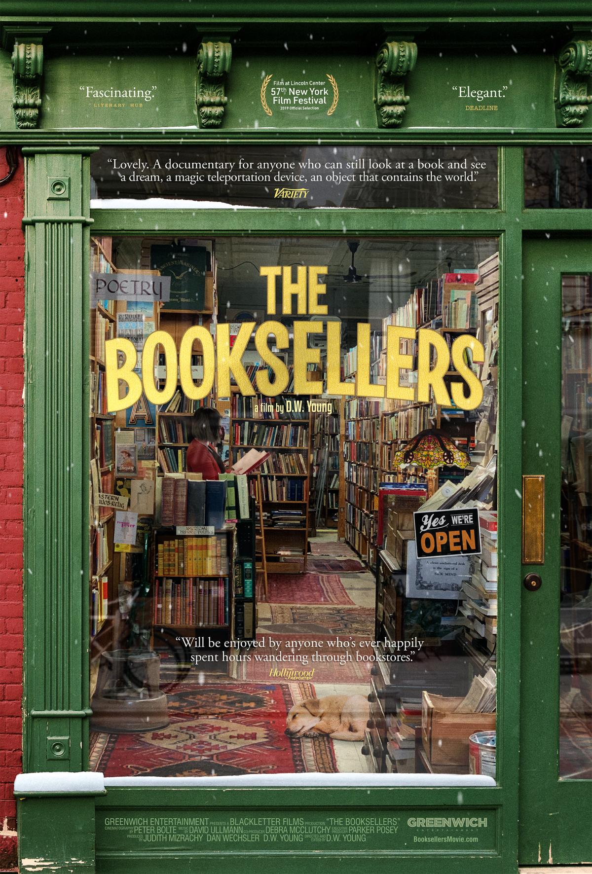 Window looking into a bookshop with text The Booksellers on the window