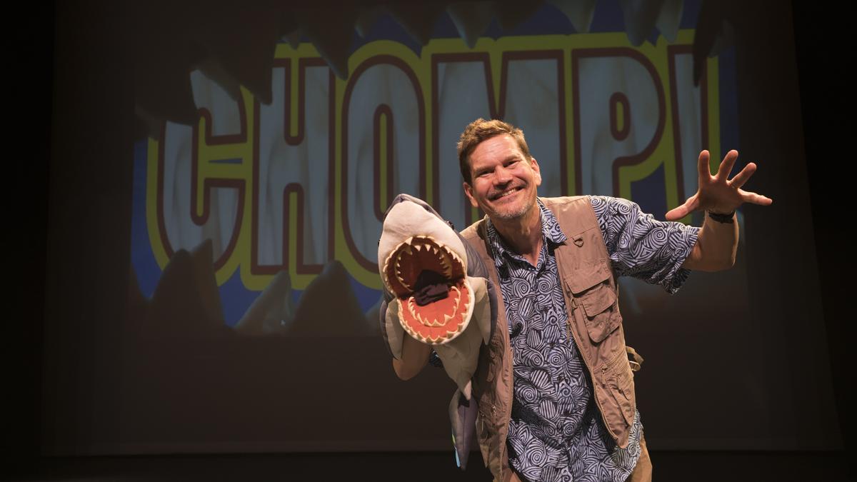 lucas miller with a shark puppet